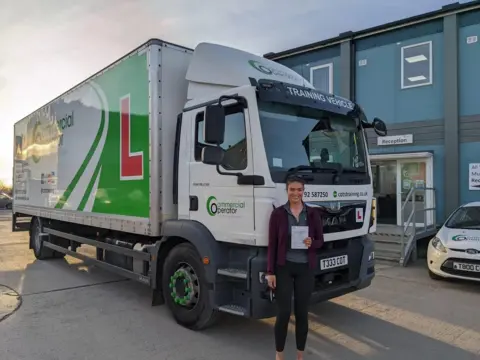 Katie Jones Katie Jones next to a HGV