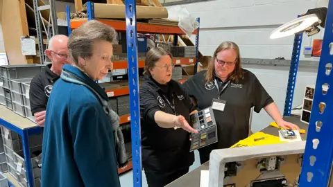 BBC/Charlie Rose HRH Princess Royal speaks to a worker
