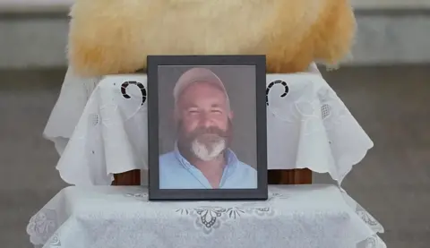 PA Media A photo of murdered Co Kerry farmer Michael Gaine on display during his funeral at the Holy Cross Church in Kenmare. Picture date: Saturday June 7, 2025. PA Photo. See PA story FUNERAL Gaine. Photo credit should read: Niall Carson/PA Wire