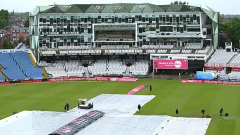 The covers are on as it rains at Headingley