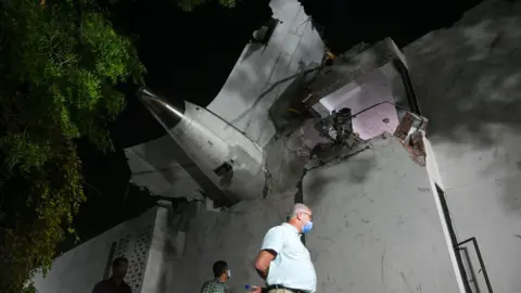 Raju Shinde/ Hindustan Times via Getty Images The image shows the Air India plane crashed in to the roof of a resident doctors' hostel in Ahmedabad, which suffered major damage in the accident. Credit: Raju Shinde/Hindustan Times via Getty Images Rescue efforts at the site of the Air India flight crash on June 12, 2025 in Ahmedabad, India. 