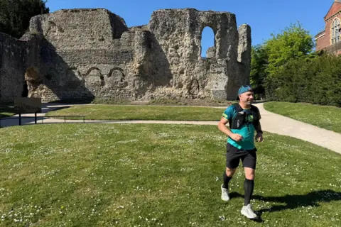 Chris runs past Reading Abbey Ruins.