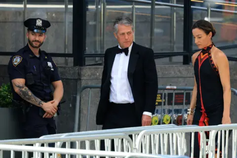 Getty Images Actor Hugh Grant and wife Anna Elisabet Eberstein arrive at Madison Square Garden in formalwear.