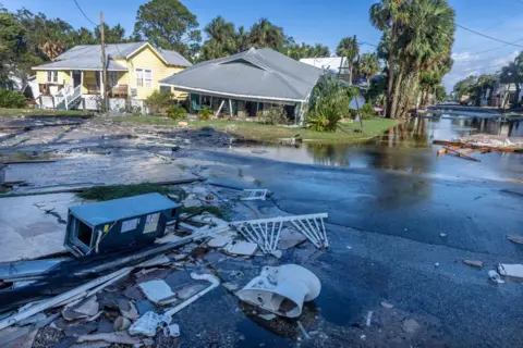  Cristóbal Herrera/EPA-EFE View of damage left behind by Hurricane Helene in Cedar Key, Florida, 