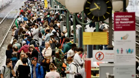 Shutterstock Delayed commuters