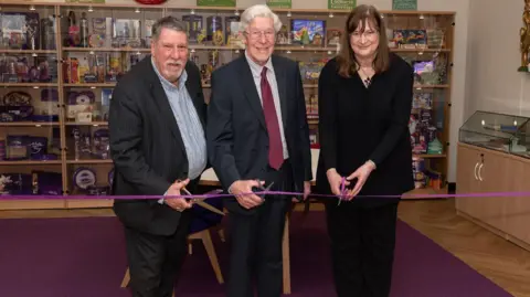 Mondelēz International Professor Carl Chinn MBE, Duncan Cadbury and Sarah Foden cutting the ribbon