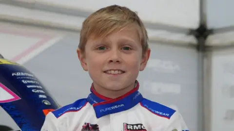 Josh posing with his Rotax World Championship trophy