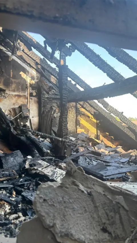 A roof space damaged by fire after lightning struck the home.