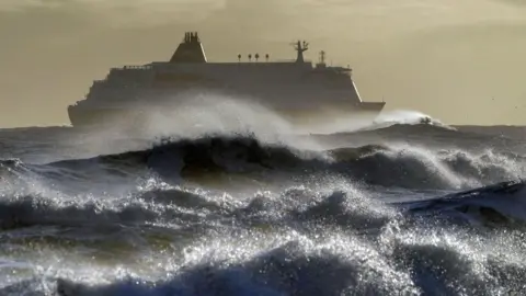 PA Media A ship in heavy waves