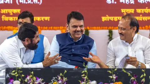 Getty Images Maharashtra Chief Minister Devendra Fadnavis, along with Deputy Chief Ministers Eknath Shinde and Ajit Pawar