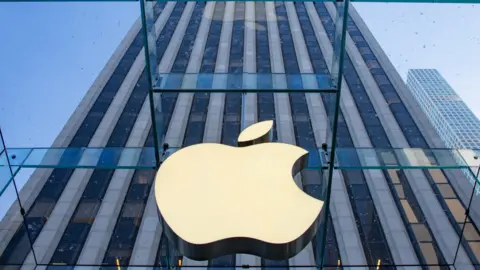 Getty Images The Apple logo in front of a high rise building