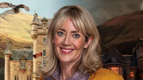 BBC / Studio Lambert A blonde woman, Francesca, is stood in front of a dramatic castle. She is smiling at the camera