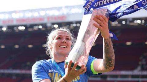 Millie Bright with the WSL trophy