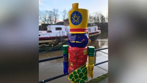 York BID A green, blue, red and yellow nutcracker statue stood on the bank of the River Ouse