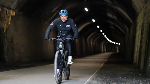 Unicef Olly Murs on a bike