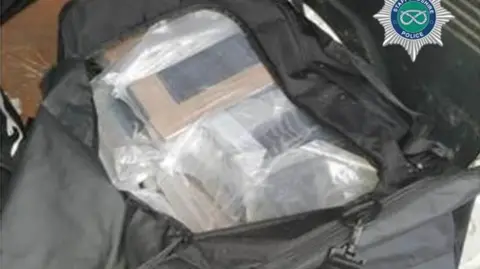 Staffordshire Police A black bag containing several blocks of cocaine