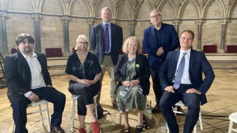 All five Lincoln constituency candidates who took part in the debate and host Tim Iredale posing for a photo