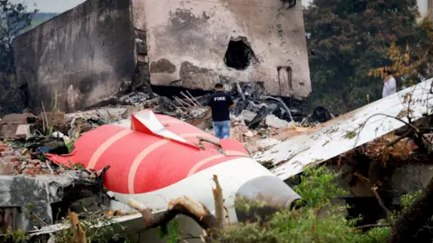 The tail end of a crashed Air India plane