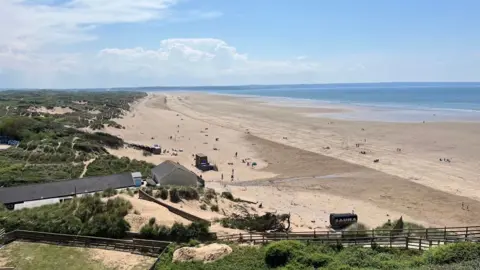 Saunton Sands seen from an elevated point at the north end of the beach with the view stretching to the opeing of the Taw Estuary