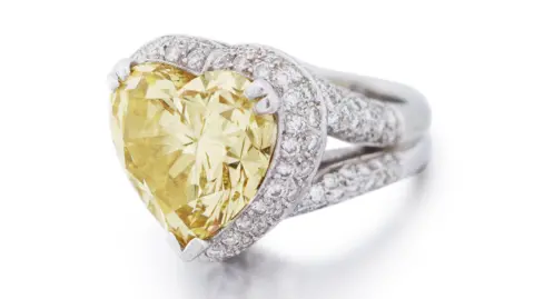 PA Dame Shirley Bassey's yellow diamond ring, estimated to sell for between 165,000 and 200,000 EUR at Sotheby's, Paris, on October 10.