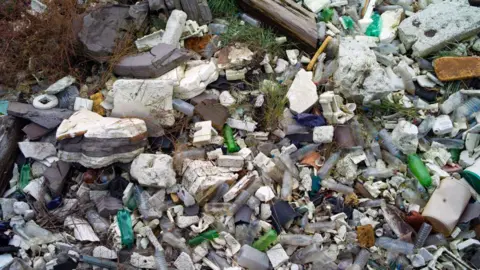 Getty Images Plastics and other detritus lining the shore of the Thames Estuary on 28 October 2019.