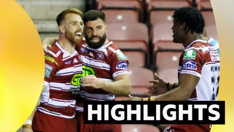 Wigan players celebrate a try against Catalans Dragons