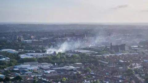 Anthony King A drone image of the area affected by the fire the following day. Some smoke can still be seen billowing from the site.