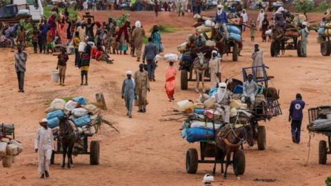 People fleeing the violence in West Darfur, cross the border into Adre, Chad, August 4, 2023.