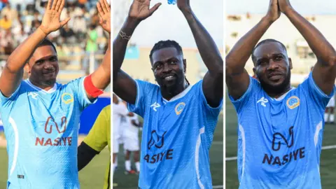 A triptych showing Samuel Eto'o, Emmanuel Adebayor and Jay Jay Okocha wearing light blue football tops and waving to the crowd from the pitch at the Mogadishu National Stadium