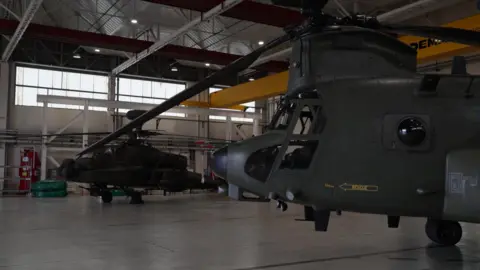 RAF Chinook helicopter at Army Aviation Centre Middle Wallop right foreground and Apache background left.