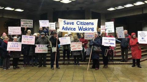 Campaigners demonstrating cuts to Citizens Advice Woking services
