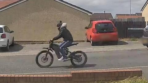 CCTV image showing e-bike rider