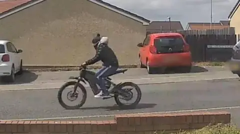 South Wales Police CCTV image showing e-bike rider