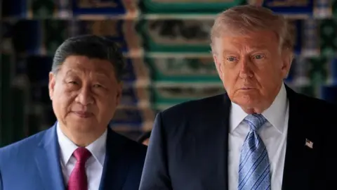 Xi and Trump walk under a decorated ceiling