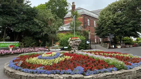 A pricre of the gardens with a range of flowers.