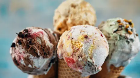 Getty Images A selection of ice cream cones with different flavour toppings