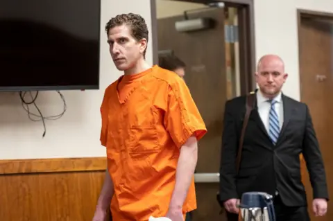 Bryan Kohberger wearing orange prison clothes enters the courtroom for his arraignment hearing in Latah County District Court in 2023.