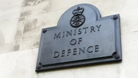 GETTY/Peter Dazeley A plaque on the outside of the Ministry of Defence building bearing the ministry's name and its coat of arms