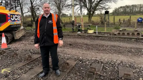 East Somerset Railway Simon Bending with a signal point tower in the background