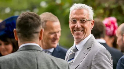 Handout/North Yorkshire Police Image of Adrian Stocks dressed in a smart grey suit with striped tie. He has grey hair and is wearing glasses.