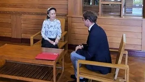 Myanmar Military Information Committee Former Myanmar president Aung San Suu Kyi talks to an official from the International Committee of the Red Cross