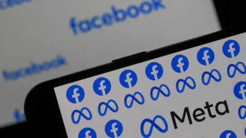 Facebook and Meta logo on phone