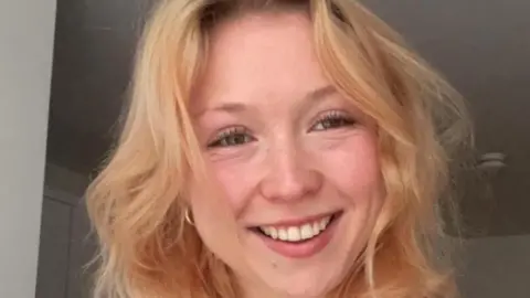 Aneesa A woman smiles at the camera