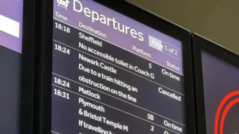 Platform departure screen showing a service to Newark Castle has been cancelled