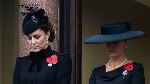 Getty Images The Princess of Wales and Duchess of Edinburgh bow their heads on the balcony of the Foreign Office building 