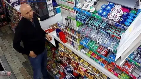 Essex Police Gheorghe Nica inside a shop