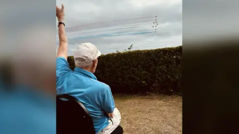 MAF/Jo Lamb Jack Hemmings waving at planes flying by