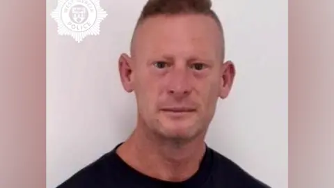 West Mercia Police A custody image of a man who is looking directly at the camera