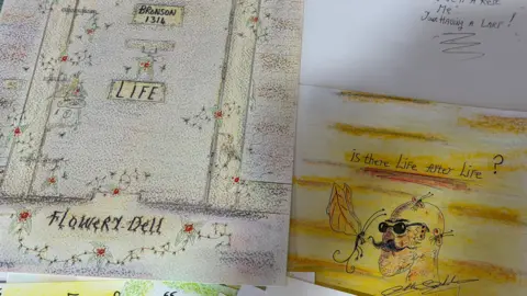 A close up image of two of the artworks. One shows a caricature of Bronson, with the question 'Is there life after life?' clearly visible