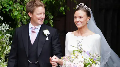 PA Media Olivia Henson and Hugh Grosvenor, the Duke of Westminster leave Chester Cathedral after their wedding